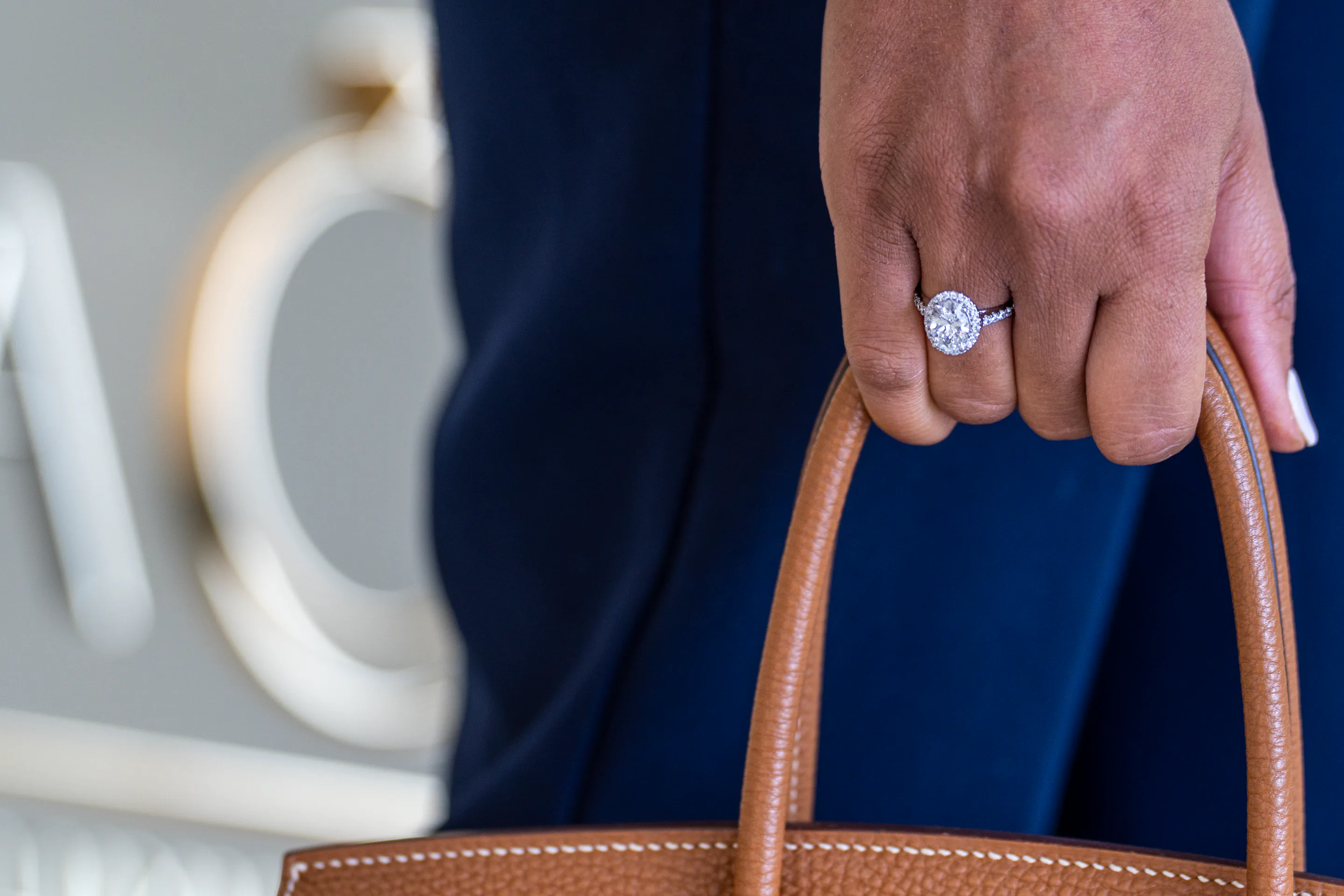 A diamond ring and designer handbag at NovaOro